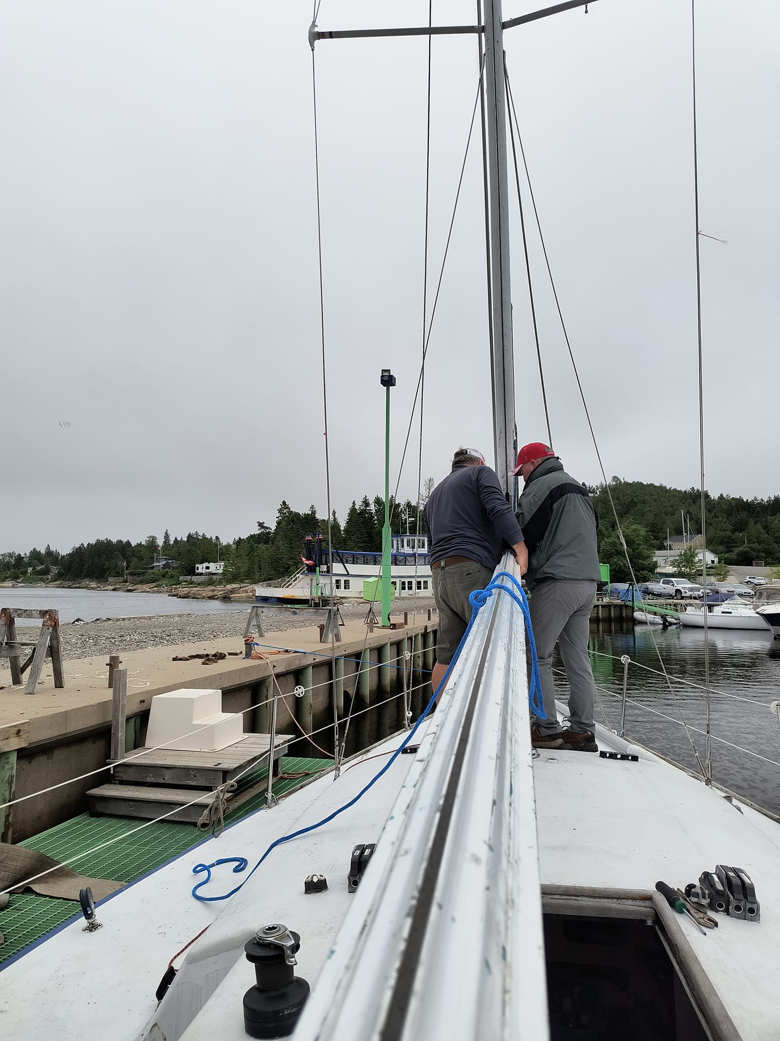 Two crew working at the mast step on Mr Jumpa's deck