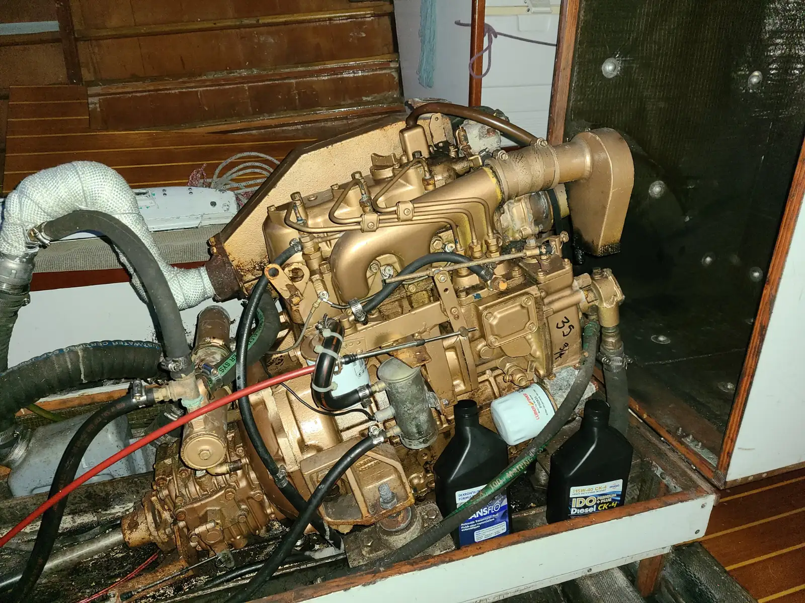 Auxiliary diesel engine in Mr Jumpa's engine bay, gold-painted block