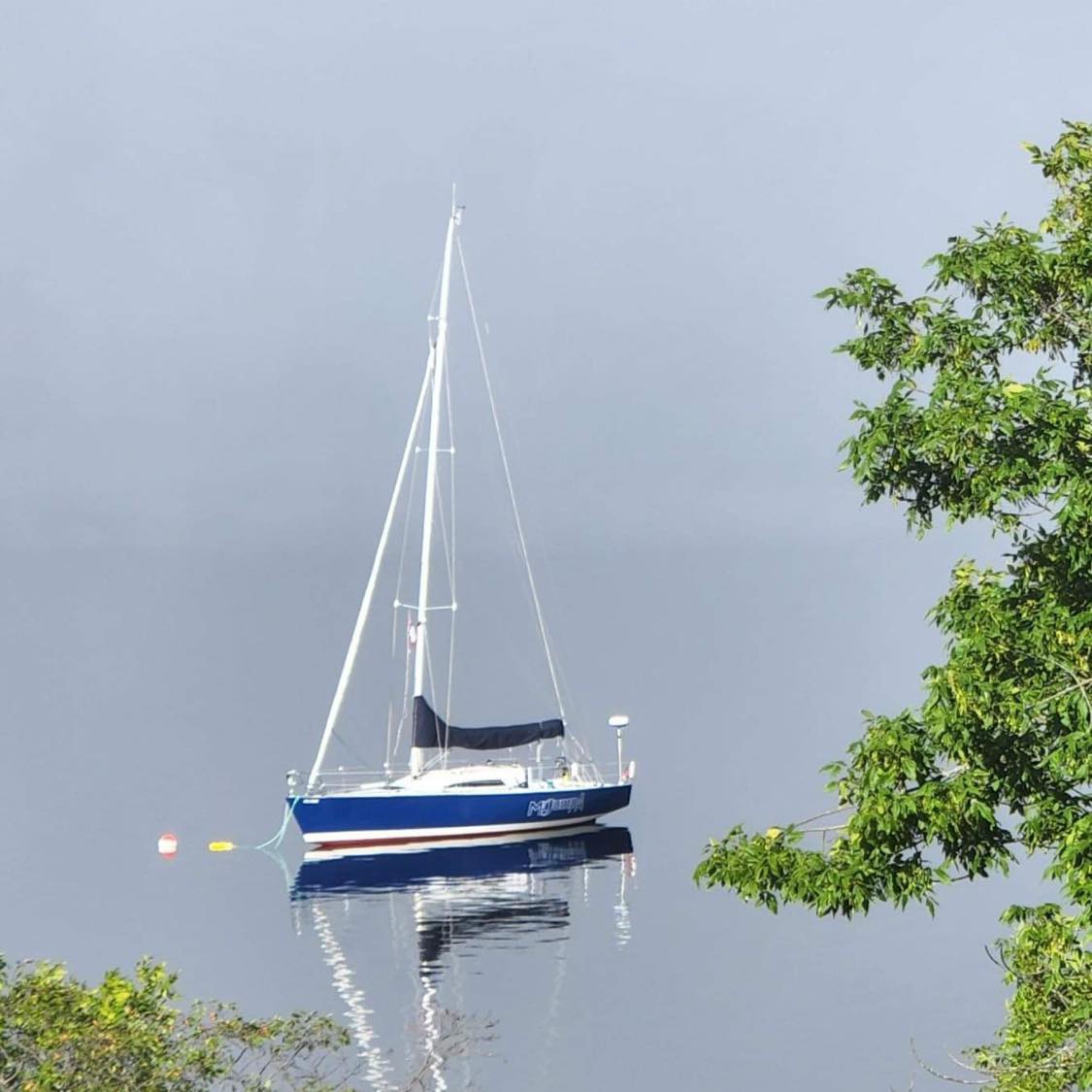 Mr Jumpa at anchor on the Bay of Fundy, sail number 22236